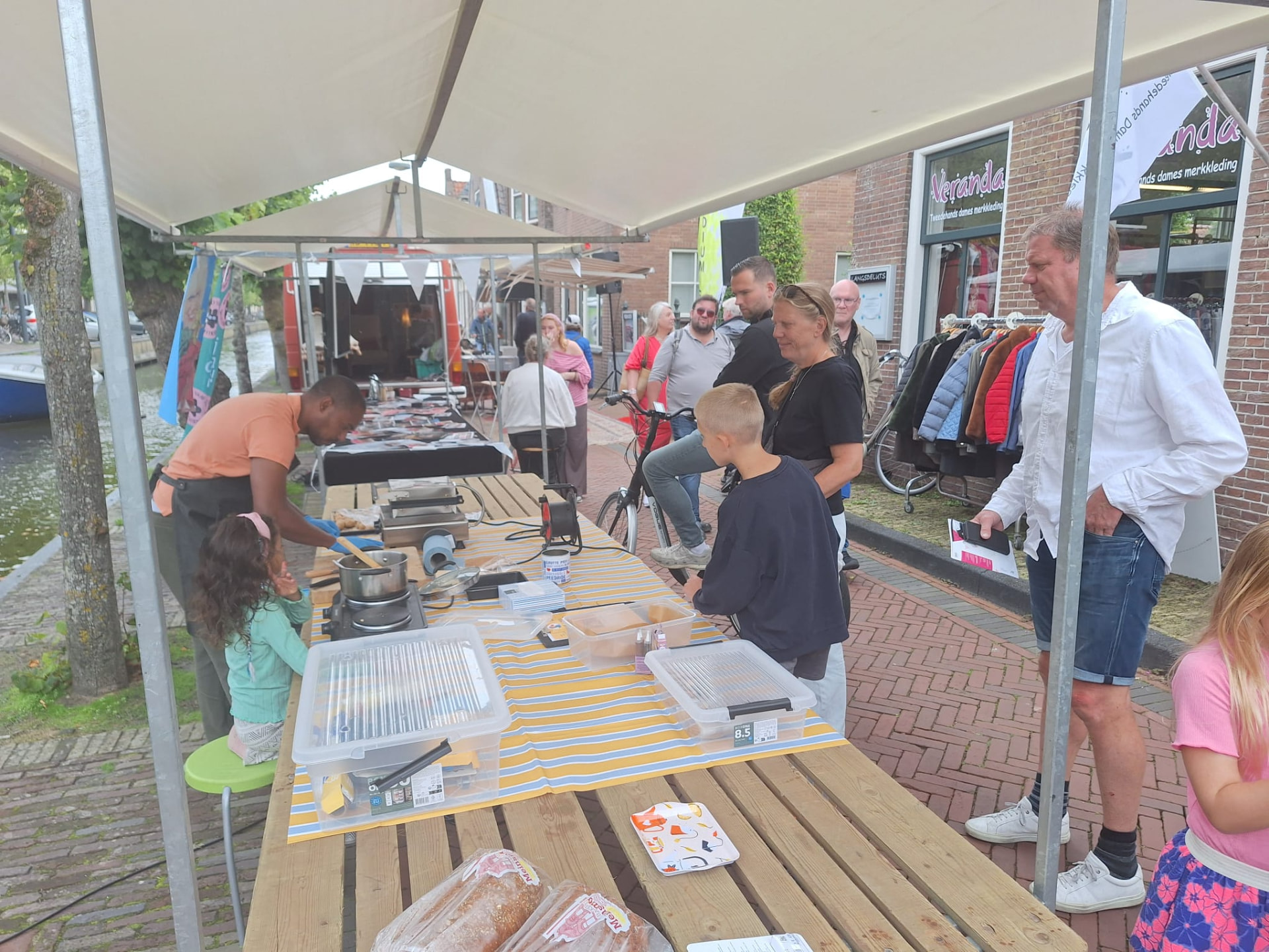 Customers watching Dodo Wafels being made at a local market